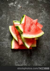 Slices of fresh watermelon. On the stone table. Slices of fresh watermelon.