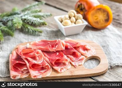 Slices of jamon on the wooden board