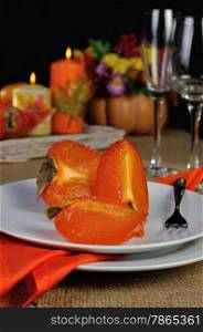 Slices of juicy ripe persimmon on a plate