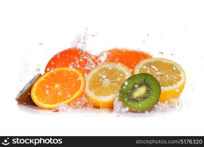 slices of kiwi, orange and lemon in water with bubbles