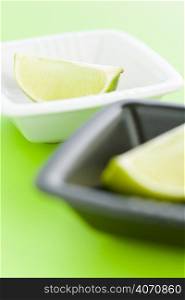 Slices of lime in containers