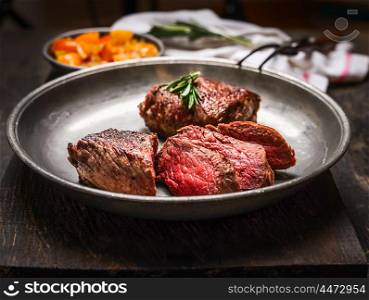 Slices of medium rare roasted meat beef steak, close up