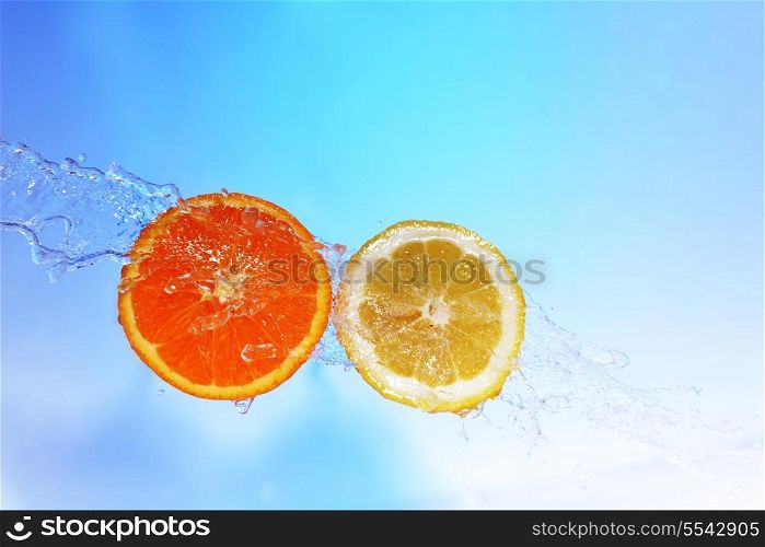 slices of orange and lemon in water with bubbles&#xA;
