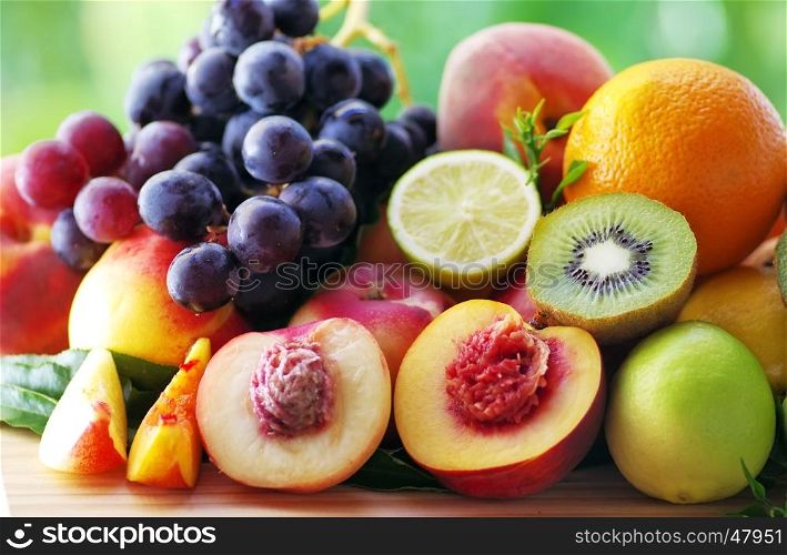 Slices of peach, grapes, kiwi and citrus fruits