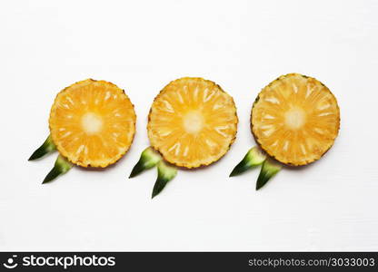 Slices of pineapple isolated on white.. Slices of pineapple isolated on white background.