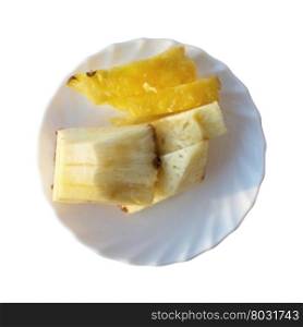 Slices of pineapple . Slices of pineapple on a white plate