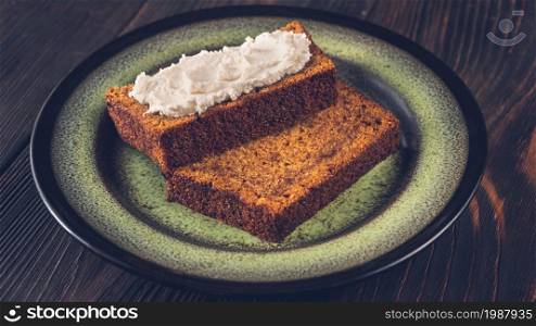 Slices of pumpkin bread with cream cheese