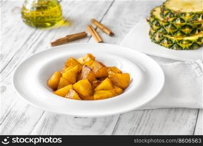 Slices of roasted caramelized pineapple with cinnamon