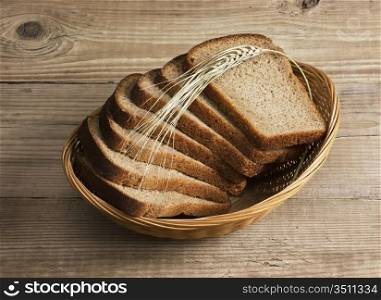 slices of rye bread and ears of corn in the basket