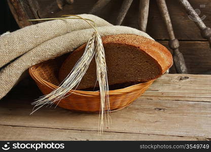 slices of rye bread and ears of corn on the wooden table