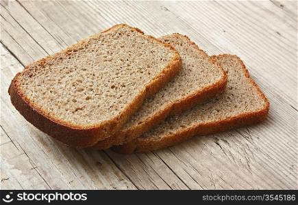 slices of rye bread on the wooden table