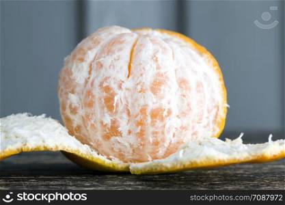 slices of tangerine without peel lying on the table during dessert, close-up of orange citrus, sweet tangerines and not sour. slices of tangerine without peel