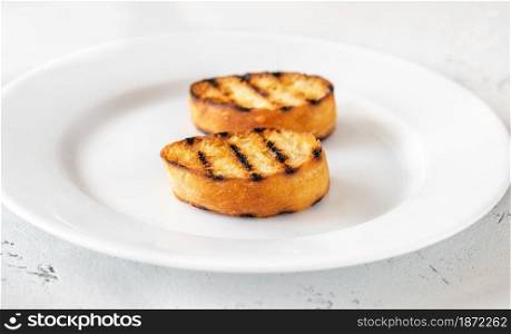 Slices of toasted bread on the serving plate