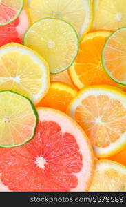 Slices of various citrus fruits background