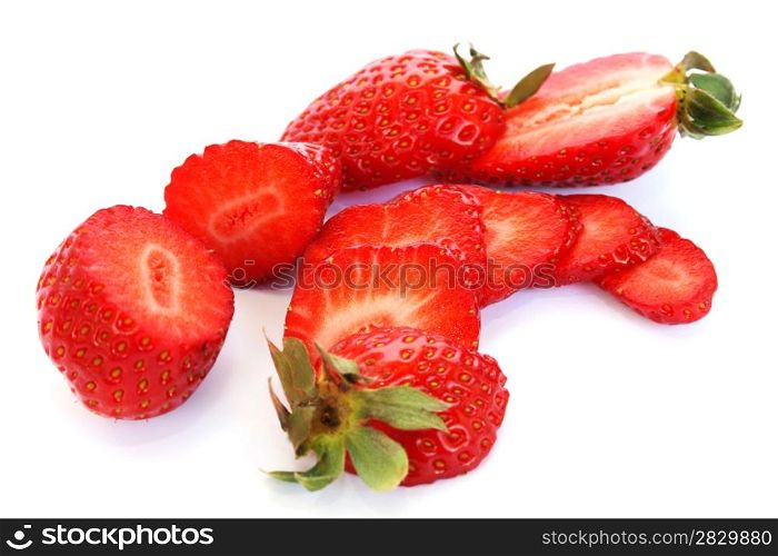 Slices strawberries isolated on white background.