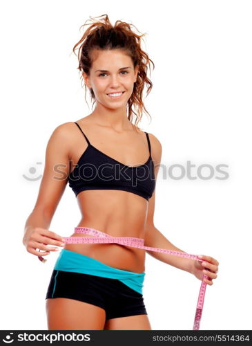 Slim brunette girl with tape measure and fitness clothes isolated on a white background