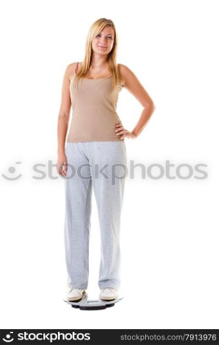Slim down concept. Woman plus size large girl on scales controlling her weight , studio shot isolated on white