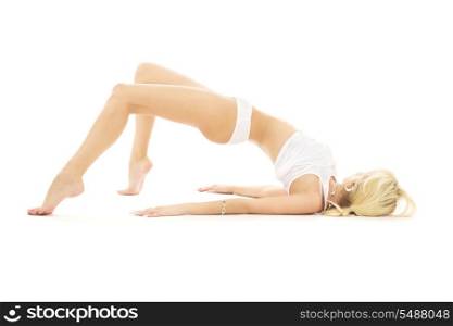 slim girl in white underwear working out