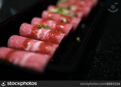 slim slices of raw meat