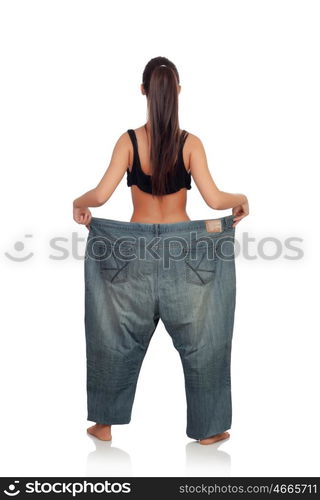 Slim woman back with huge pants isolated on a white background