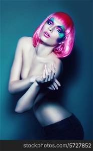 slim woman in pink wig