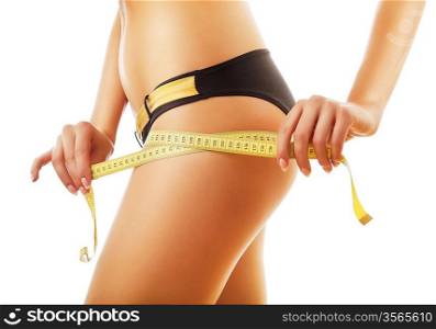 slimming woman measuring her body on white background