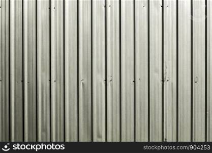 Sliver shining ridged garage metallic wall.Background and texture.