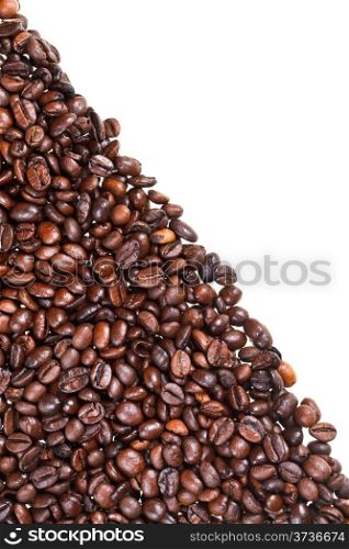 slope from roasted coffee beans close up on white background