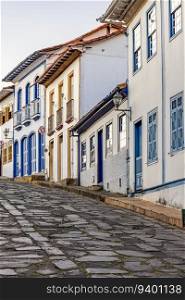 Slope with stone pavement and colonial houses in the city of Diamantina, state of Minas Gerais. Slope with stone pavement and colonial houses