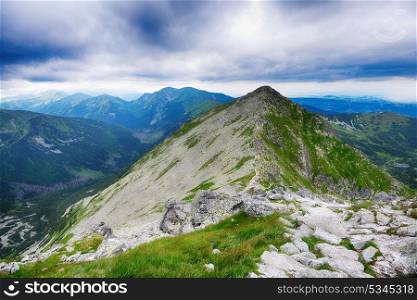 slopes and peaks of mountains and blue sky landscape