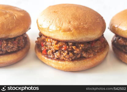 Sloppy joe - American sandwich on the white plate close up