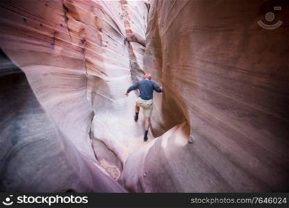 Slot canyon in Grand Staircase Escalante National park, Utah, USA. Unusual colorful sandstone formations in deserts of Utah are popular destination for hikers.
