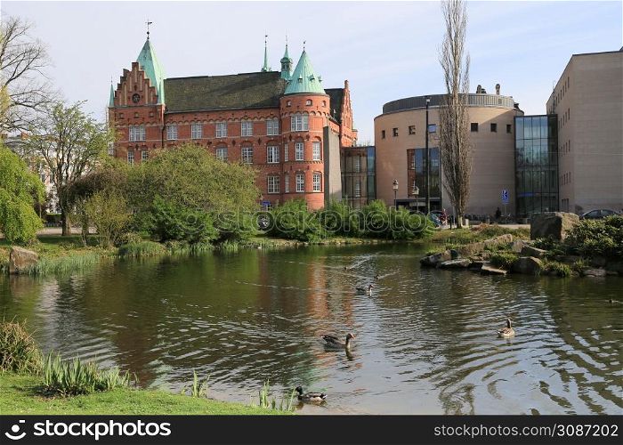 Slottsparken park pond and city library buildings, Malmo, Sweden8