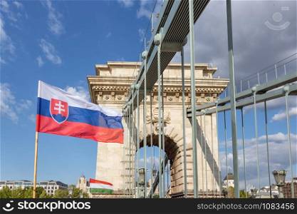 Slovak and Hungarian flag at chain bridge Budapest, capital city of Hungary. Slaovak and Hungarian flag at chain bridge Budapest, Hungary
