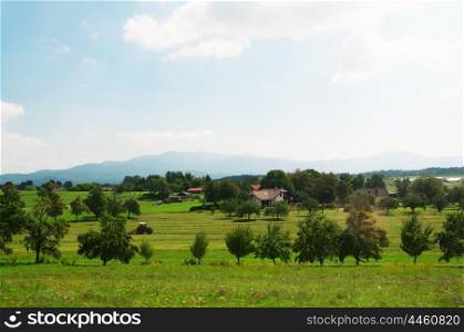 slovenia outdoor general view tractor houses and trees landscape