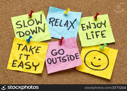 slow down, relax, take it easy, enjoy life - motivational lifestyle reminders on colorful sticky notes