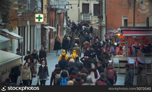 Slow motion shot of everyday people traffic on the streets of Venice, Italy.