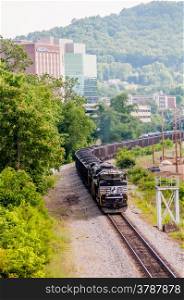 slow moving Coal wagons on railway tracks