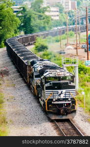 slow moving Coal wagons on railway tracks