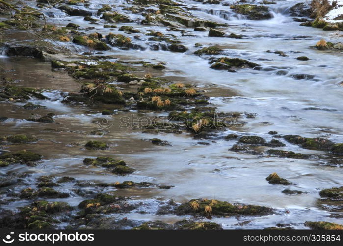 Slow river with rocky path