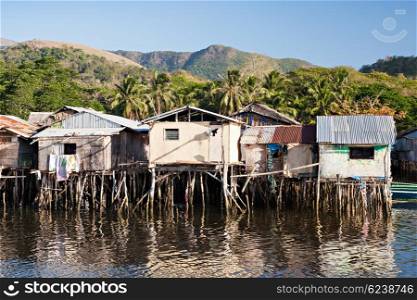 Slum houses staying on stilts in the sea