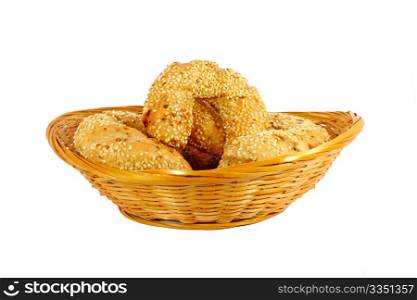 Smal rolls in a little woven basket isolated on white
