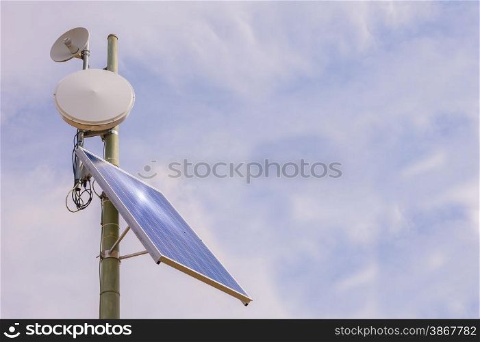 Small antenna booster with solar panel, in the mountains