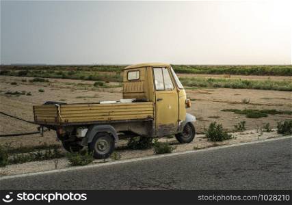 Small apo vintage truck in farm. Sunset