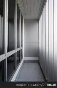 Small balcony near the conference room with the metal fence, modern office building in the city of Thailand.