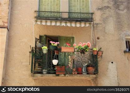 Small balcony with flowers in the Provence