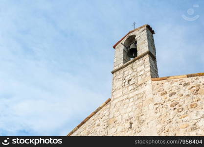 Small bell tower with a bell of a country church in the 13th century