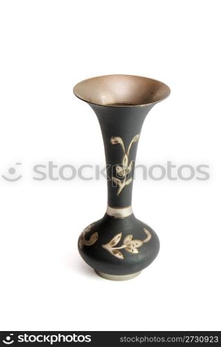 Small black metal jug with engraved flowers isolated
