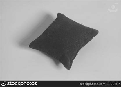 Small Black Velvet Pillow on gray background