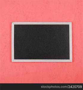 small blank blackboard coral painted wall